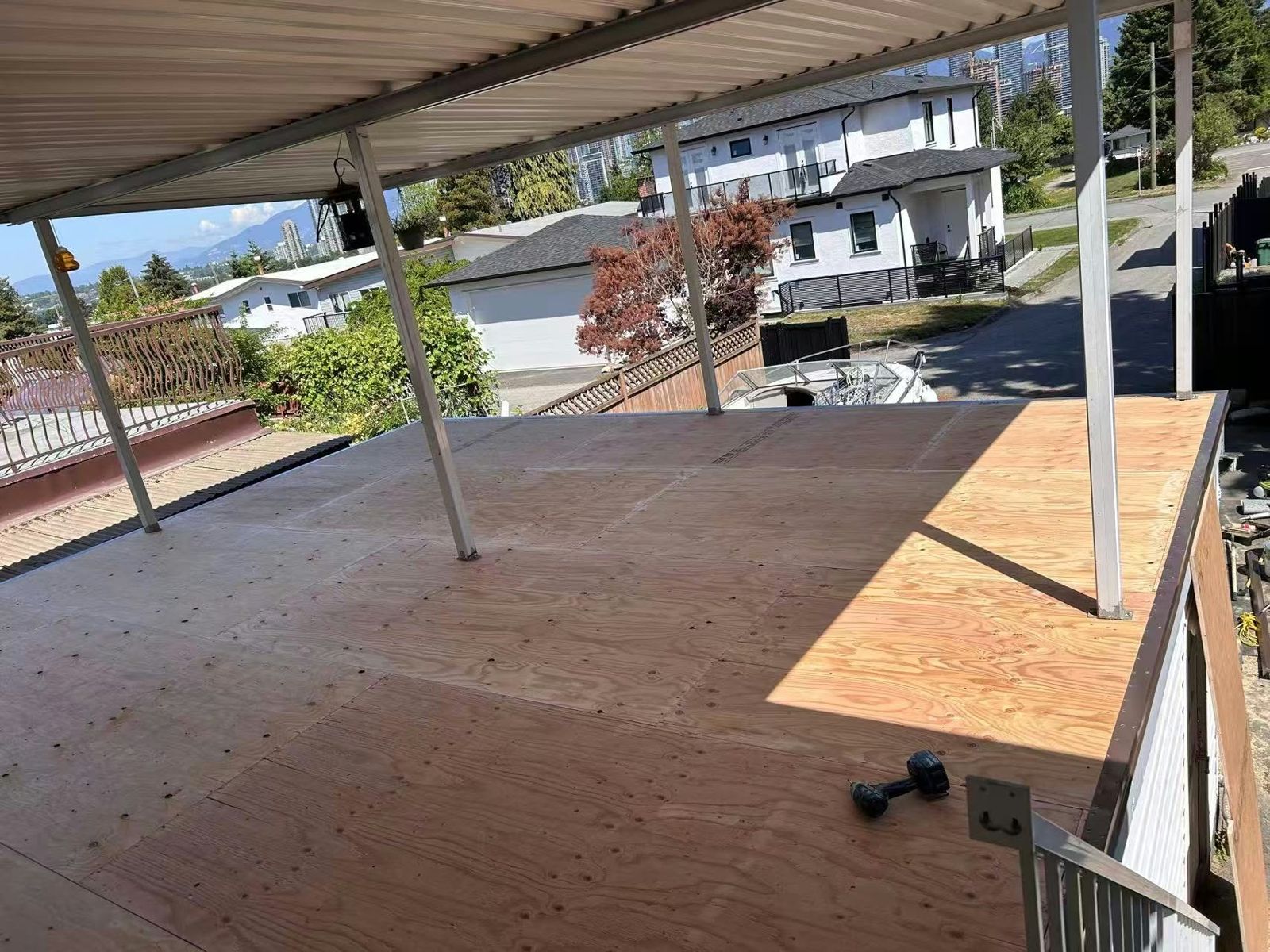 Before: Covered deck: new plywood to finished vinyl